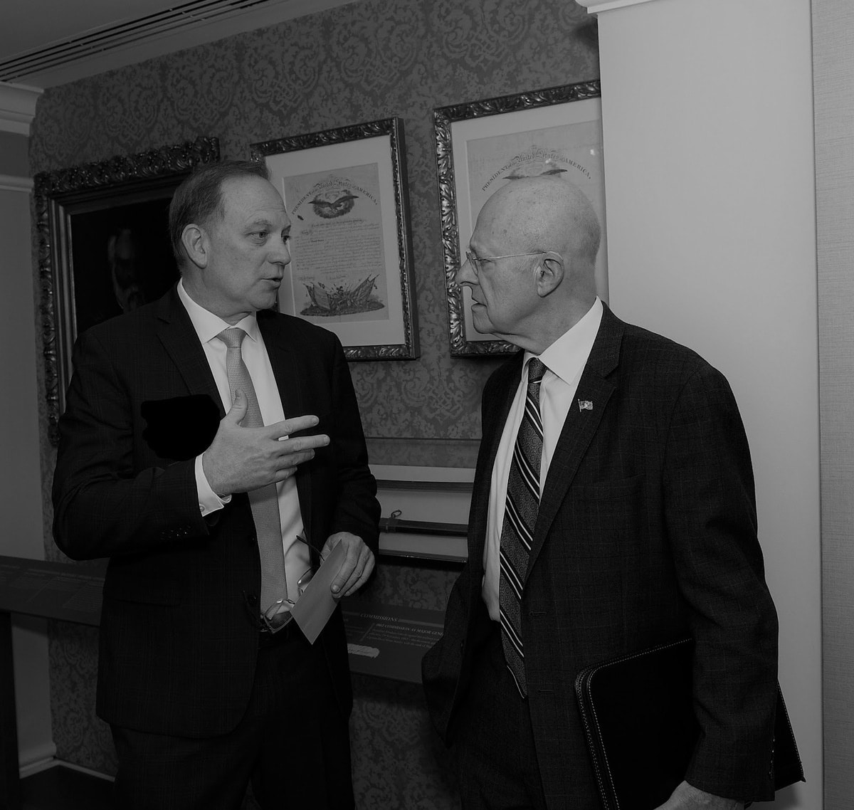 Director of National Intelligence, James Clapper, and Dr. Parker talk during a meeting in Washington DC.