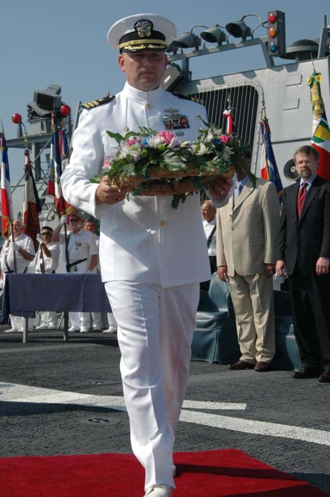 Dr. Parker lays wreath off the coast of France in honor of the French Resistance during WWII.